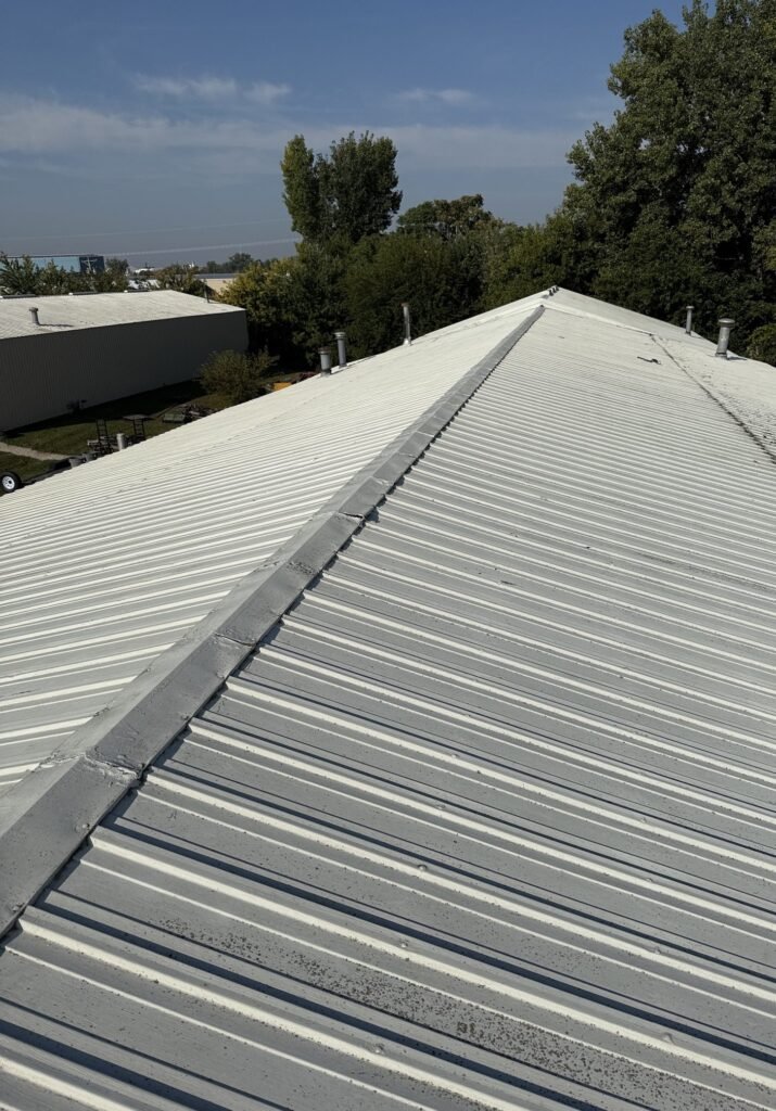 Repaired ridge cap on a commercial metal roof