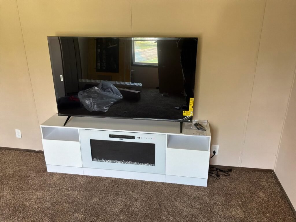 Assembled white TV stand with built-in electric fireplace